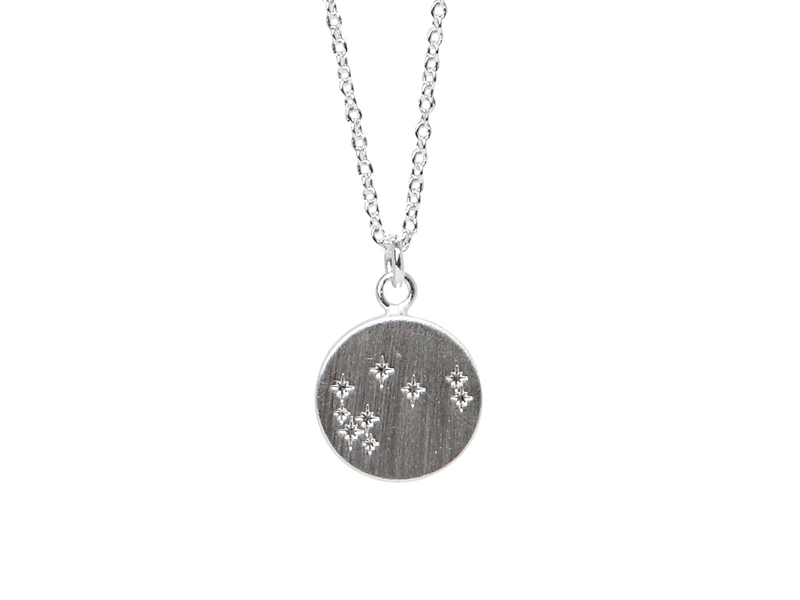 A silver necklace engraved with 9 Matariki stars from Little Taonga