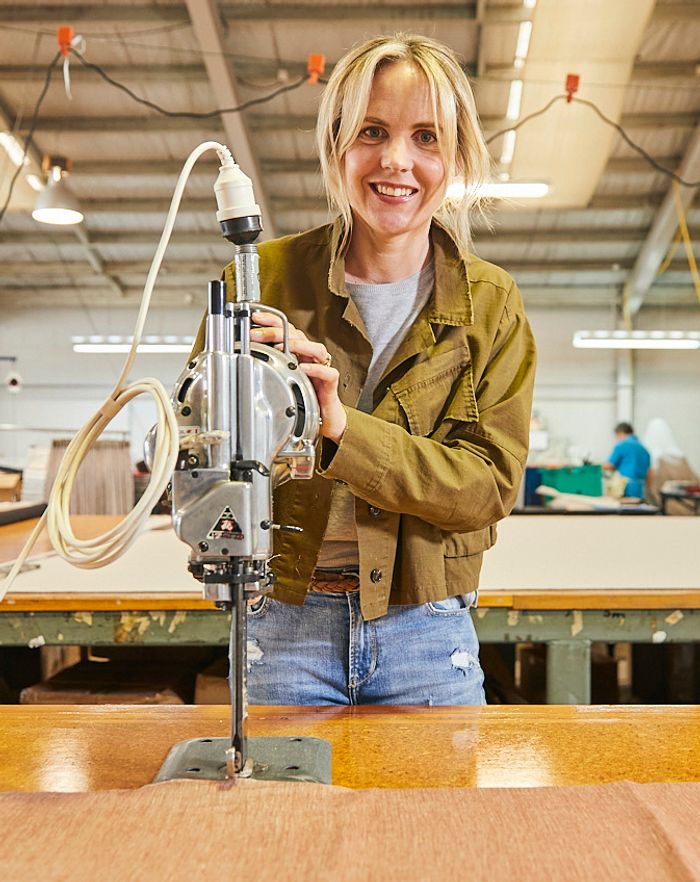 Libby Caughey working textile machinery