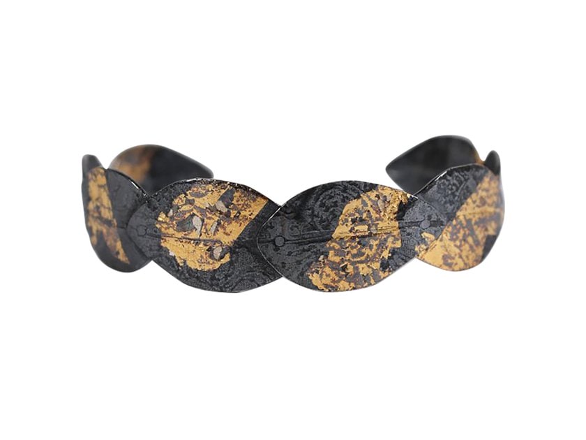 Black and gold Sally Herbert cuff from The Poi Room