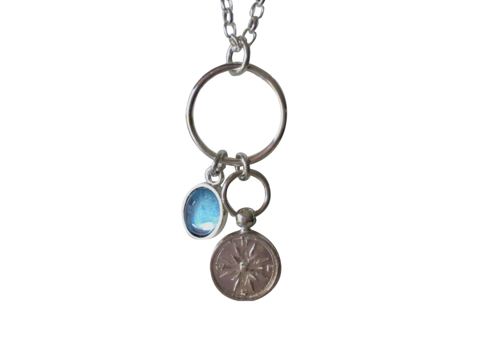 Lisa Hoskin Starkling Silver Compass Necklace with a blue gemstone and compass pendant