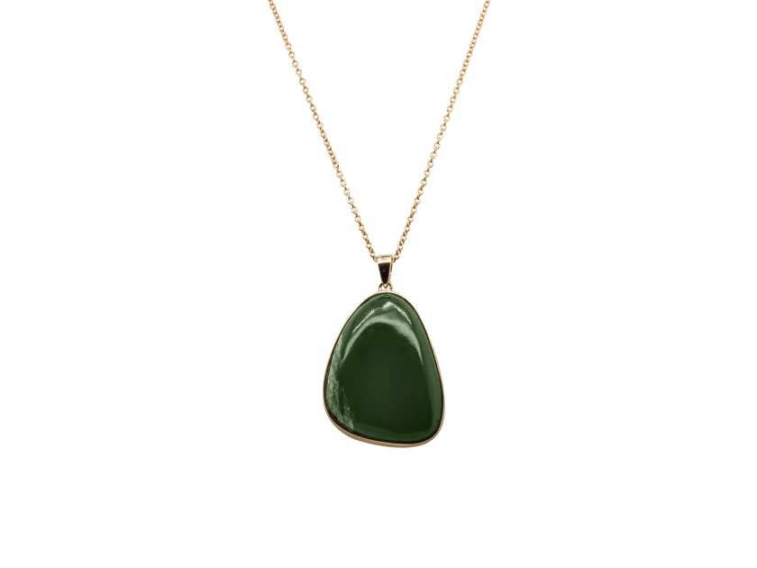 A pounamu greenstone necklace with a gold chain from Walker & Hall 