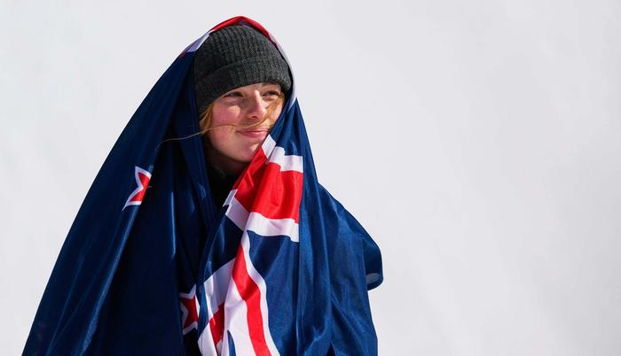 Zoi Sadowski-Synott draped in a New Zealand flag