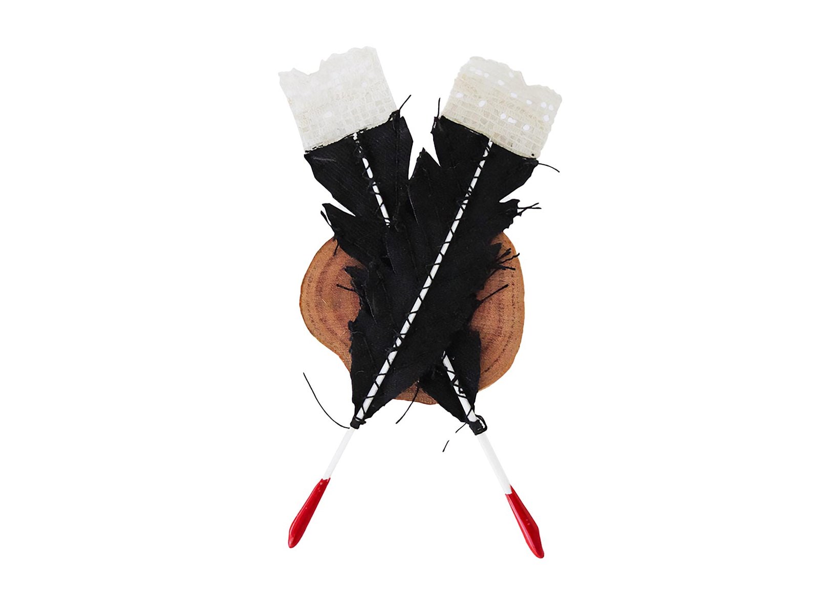 Brooch with two huia feathers dipped in red and a wood back by Aimee Gruar