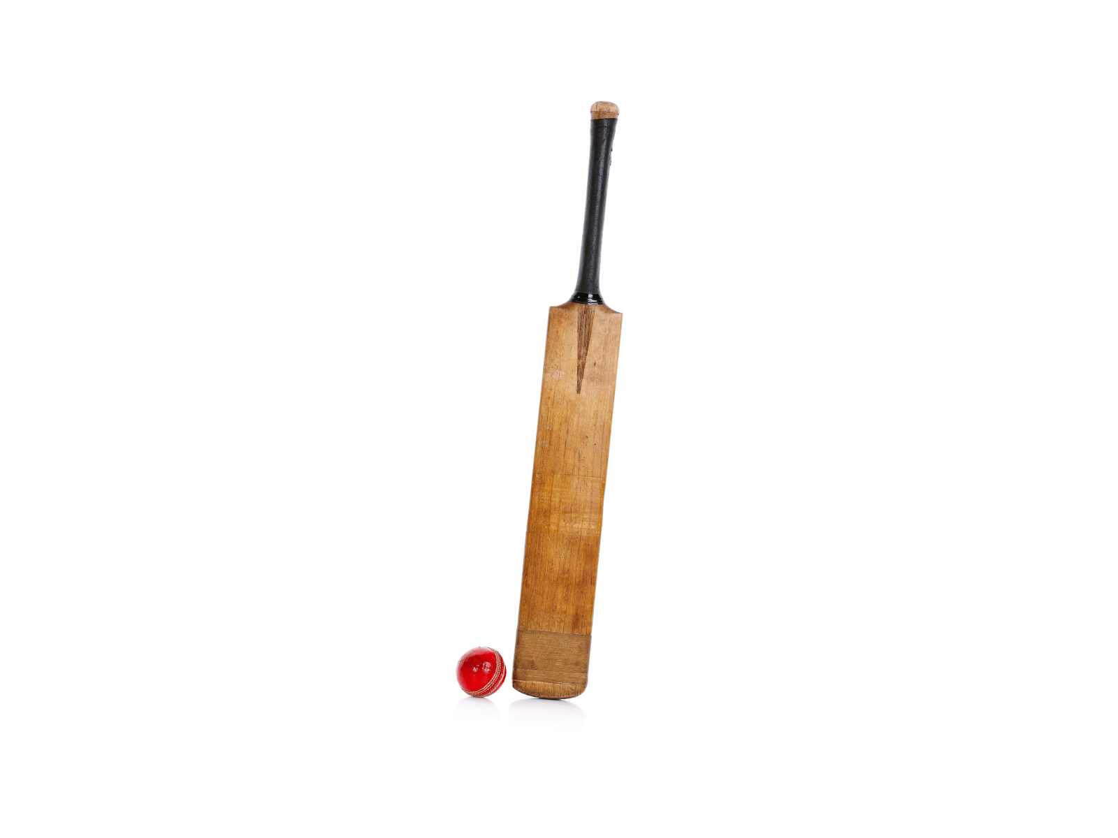 A wood cricket bat and a red ball 