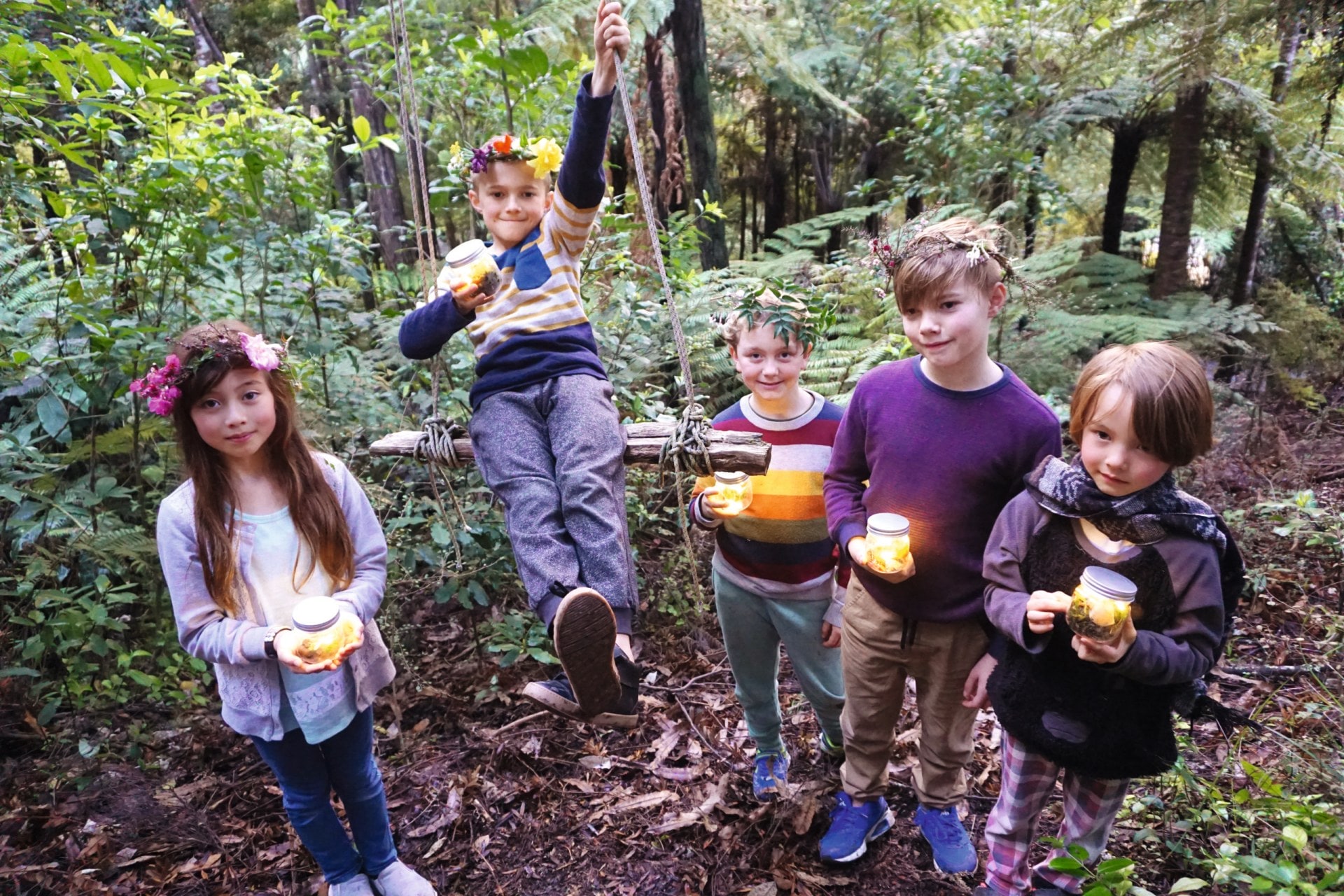 Children in forest holding fairy lanterns 