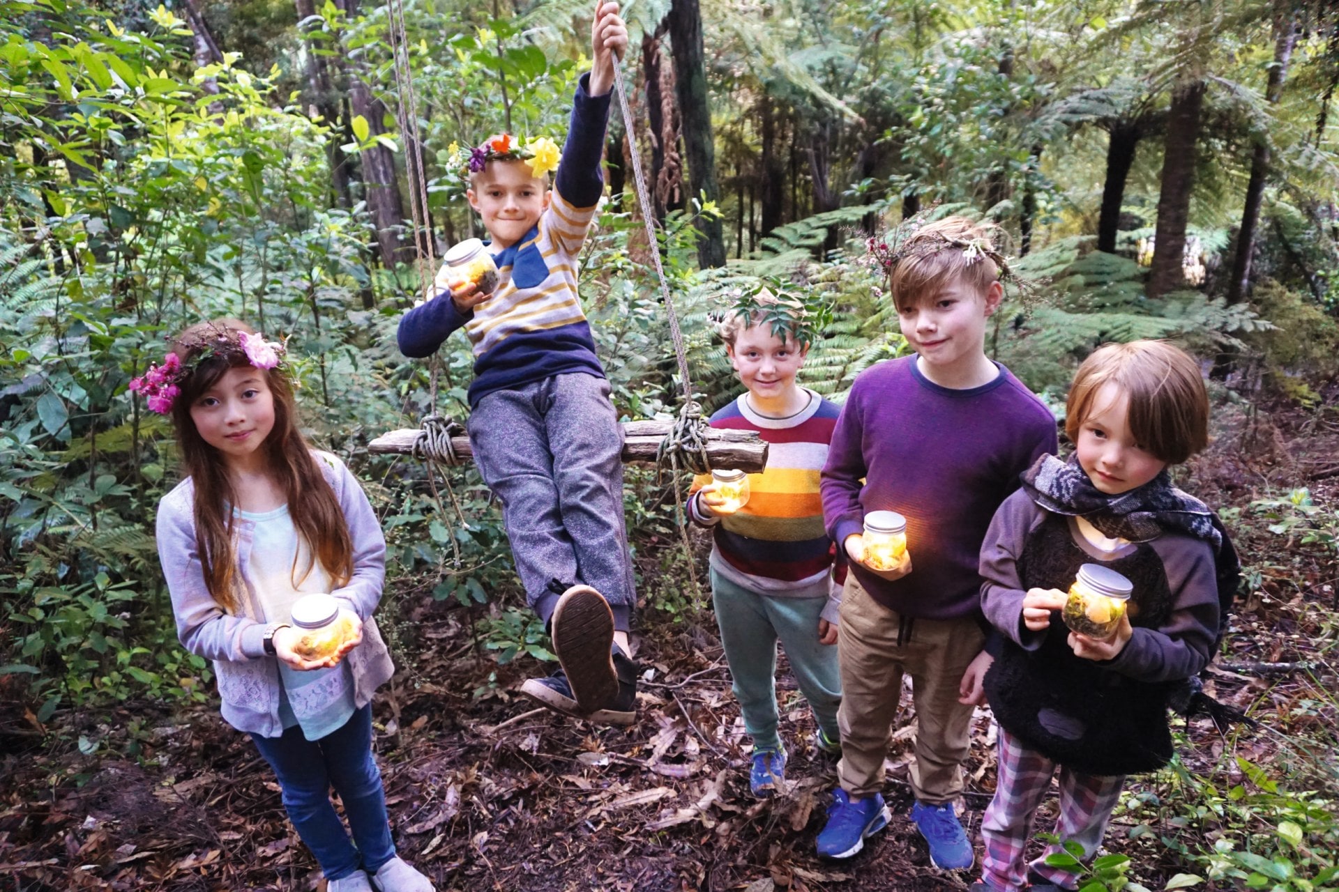 Children in forest holding fairy lanterns