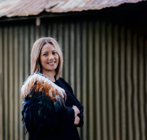 Hiria Faofua wearing a black top and white and brown korowai