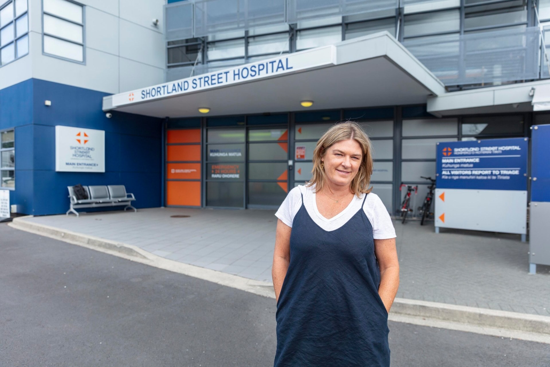 Kelly Martin in front of Shortland Street set