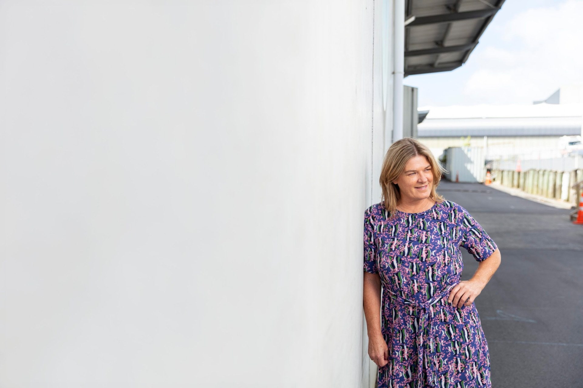 Kelly Martin wearing purple patterned dress