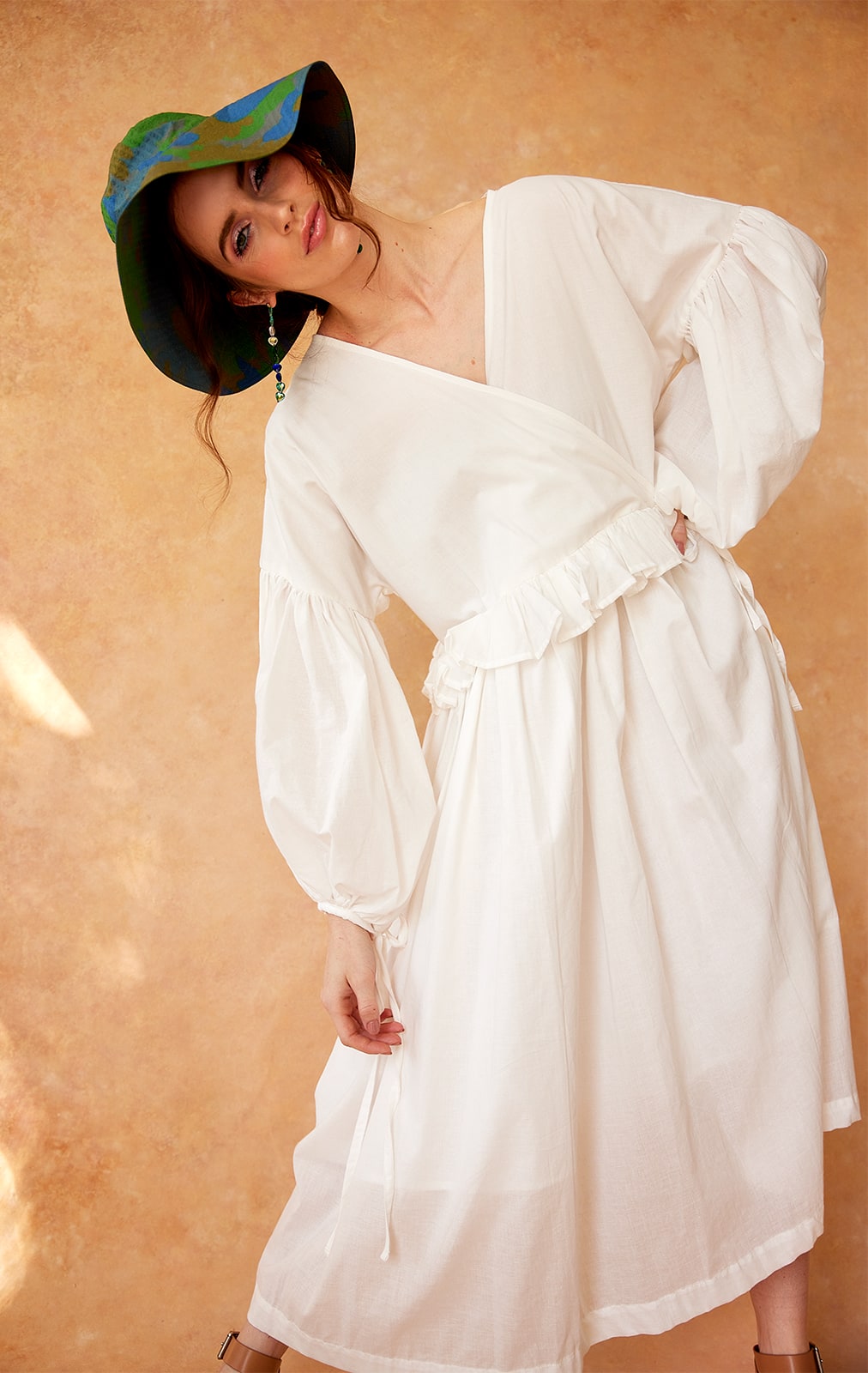 Model wearing long white Layplan dress