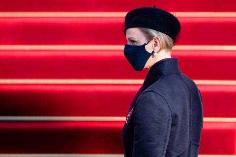 Princess Charlene of Monaco wearing black outfit and face mask