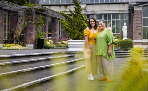 Stacey Leilua with her arms around Ana Tuisila at the Auckland Botanic Gardens