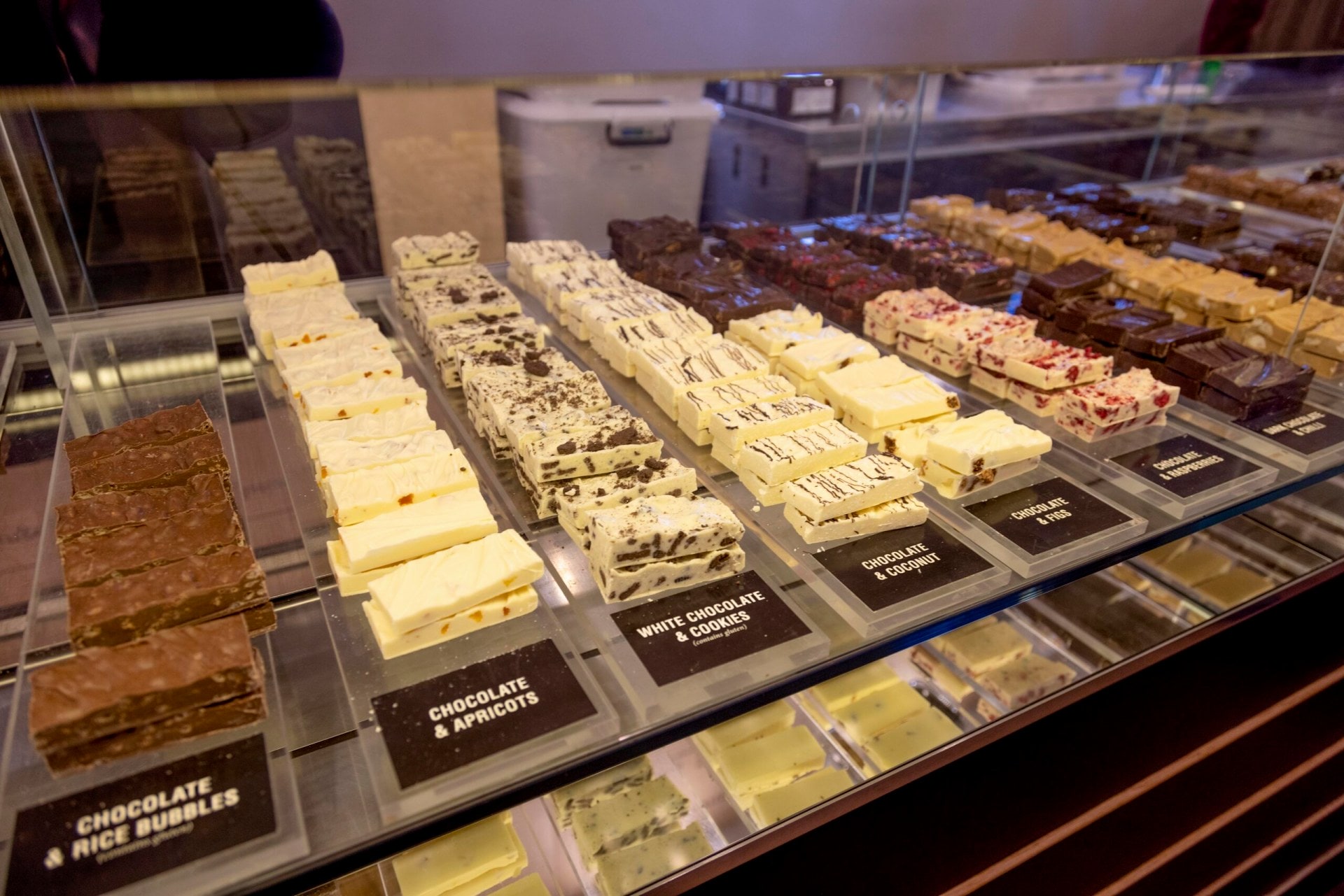 Various flavoured slices displayed on shelf at Patagonia in Queenstown