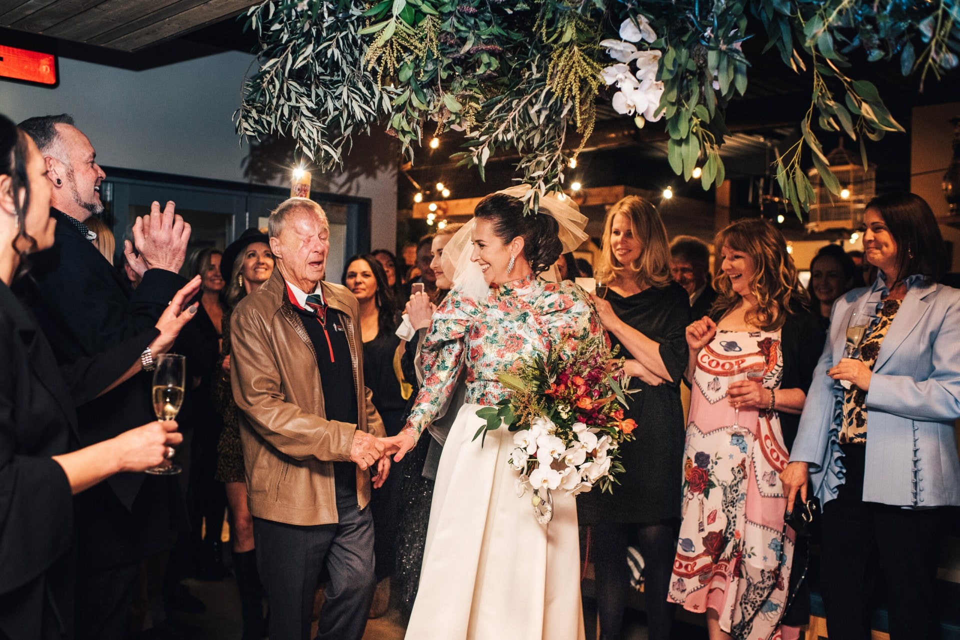 Penelope Johnson and Sam Gruar and guests on their wedding day