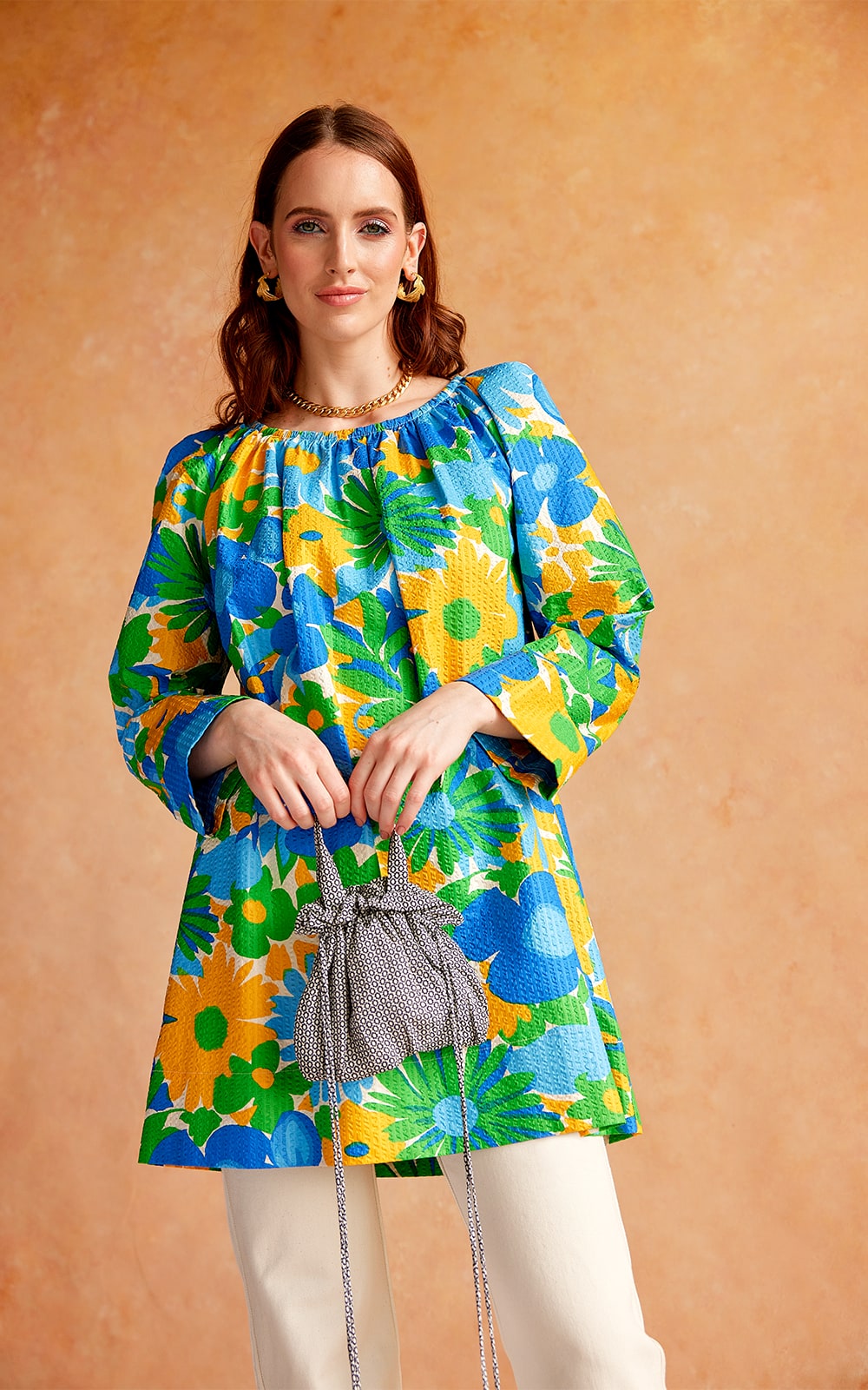 Model wearing floral Penny Sage tunic