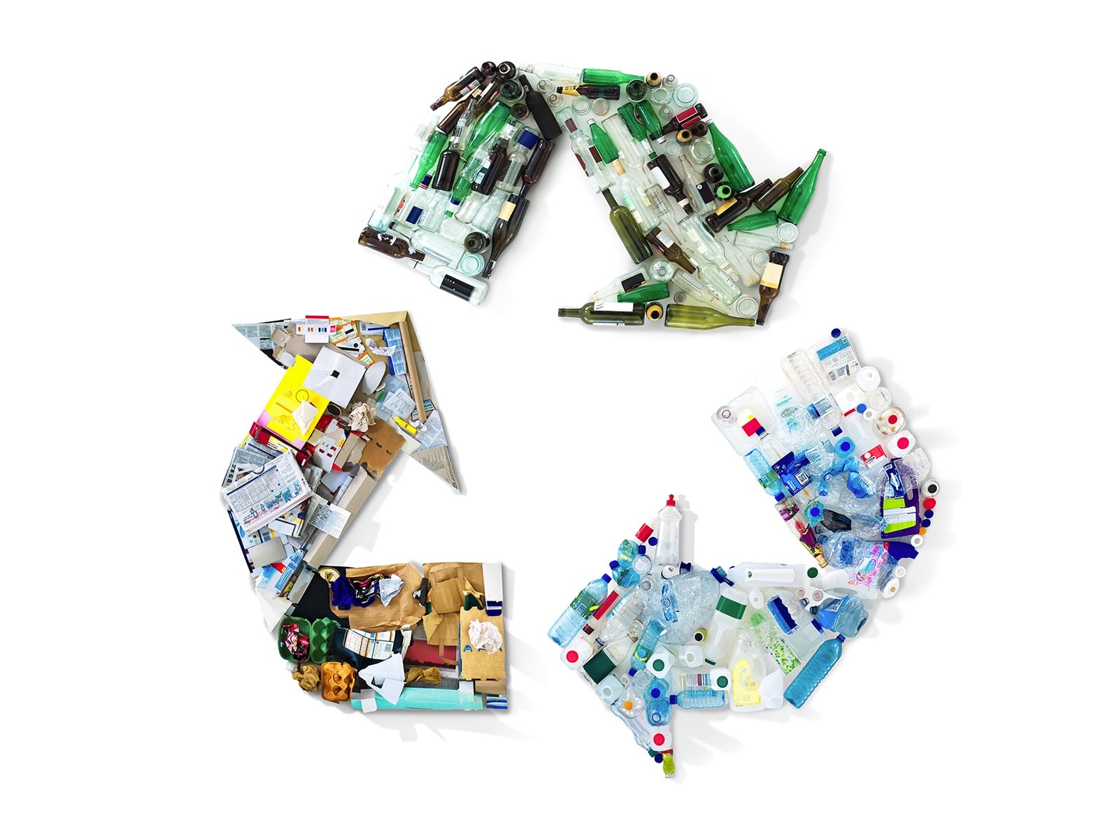 Recycling items arranged in a shape of a recycling symbol