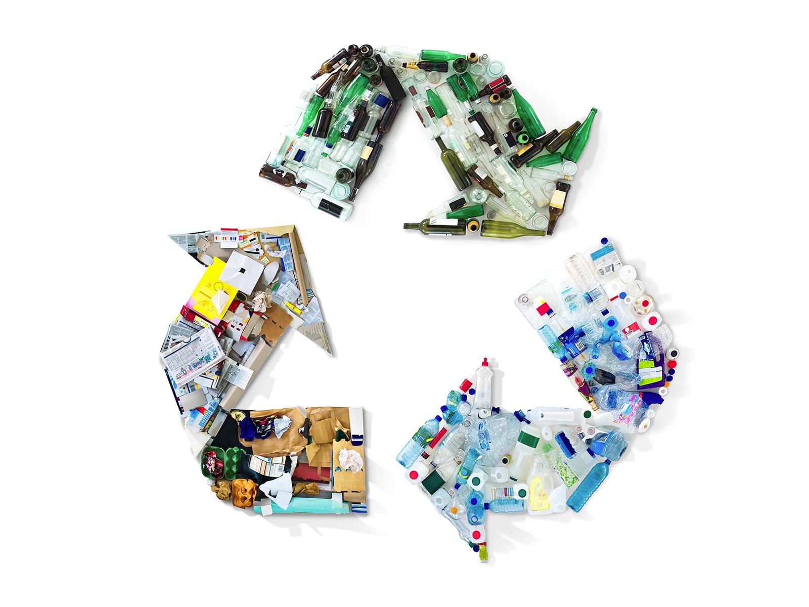 Recycling items arranged in a shape of a recycling symbol