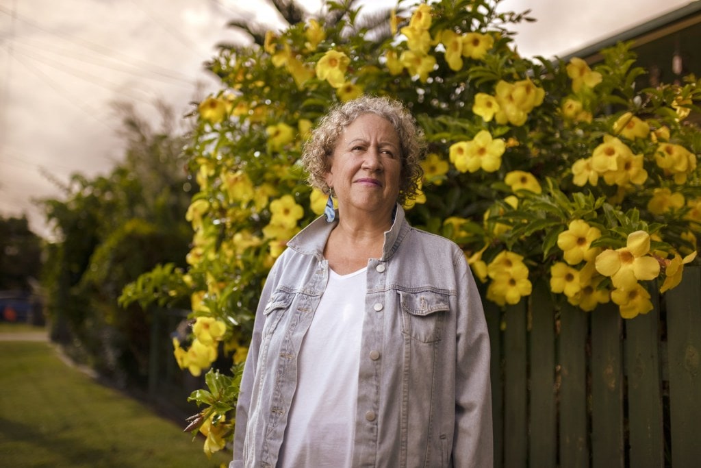 Sharon Armstrong standing by yellow tree