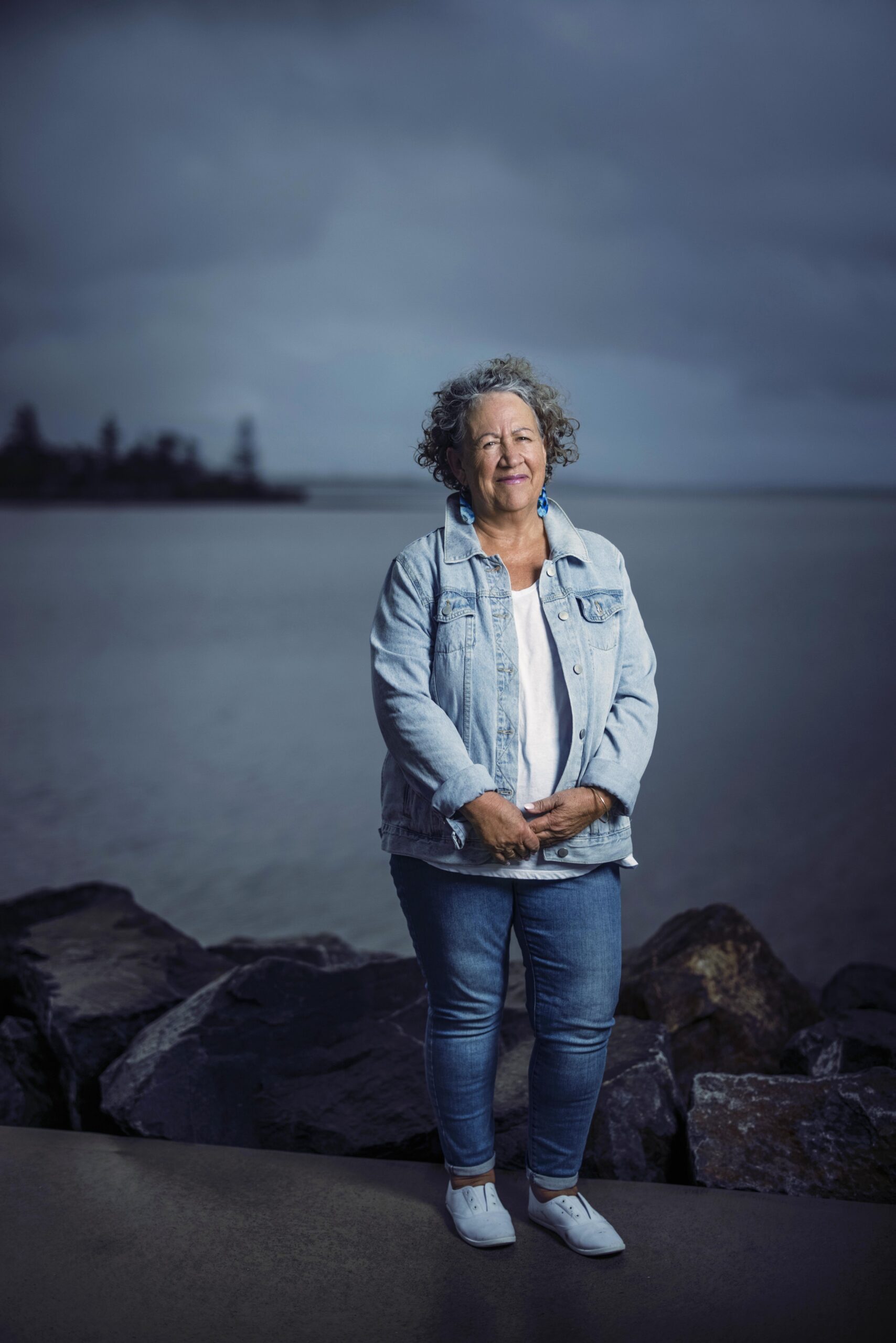 Sharon Armstrong standing by ocean