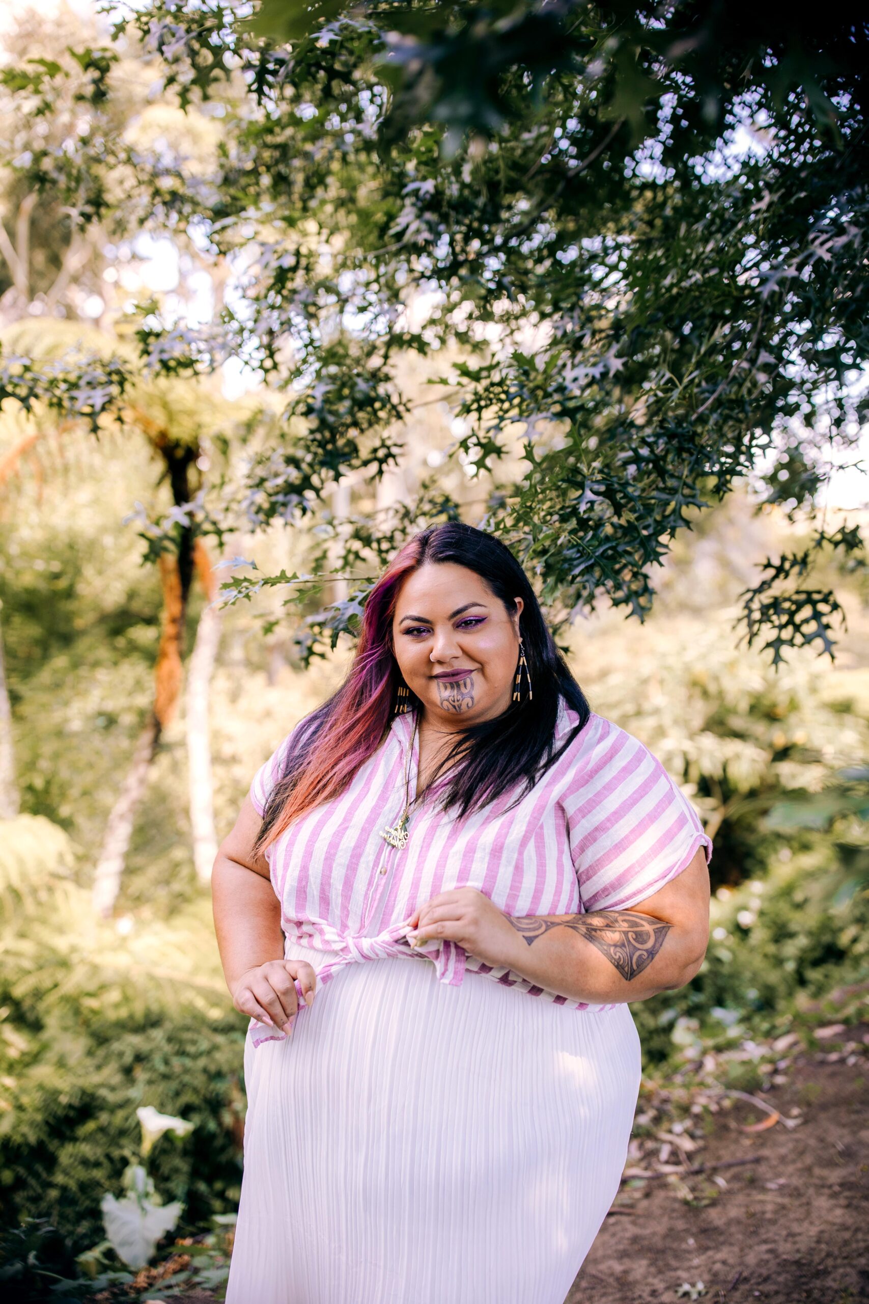 Siobhan Tumai wearing pink striped dress