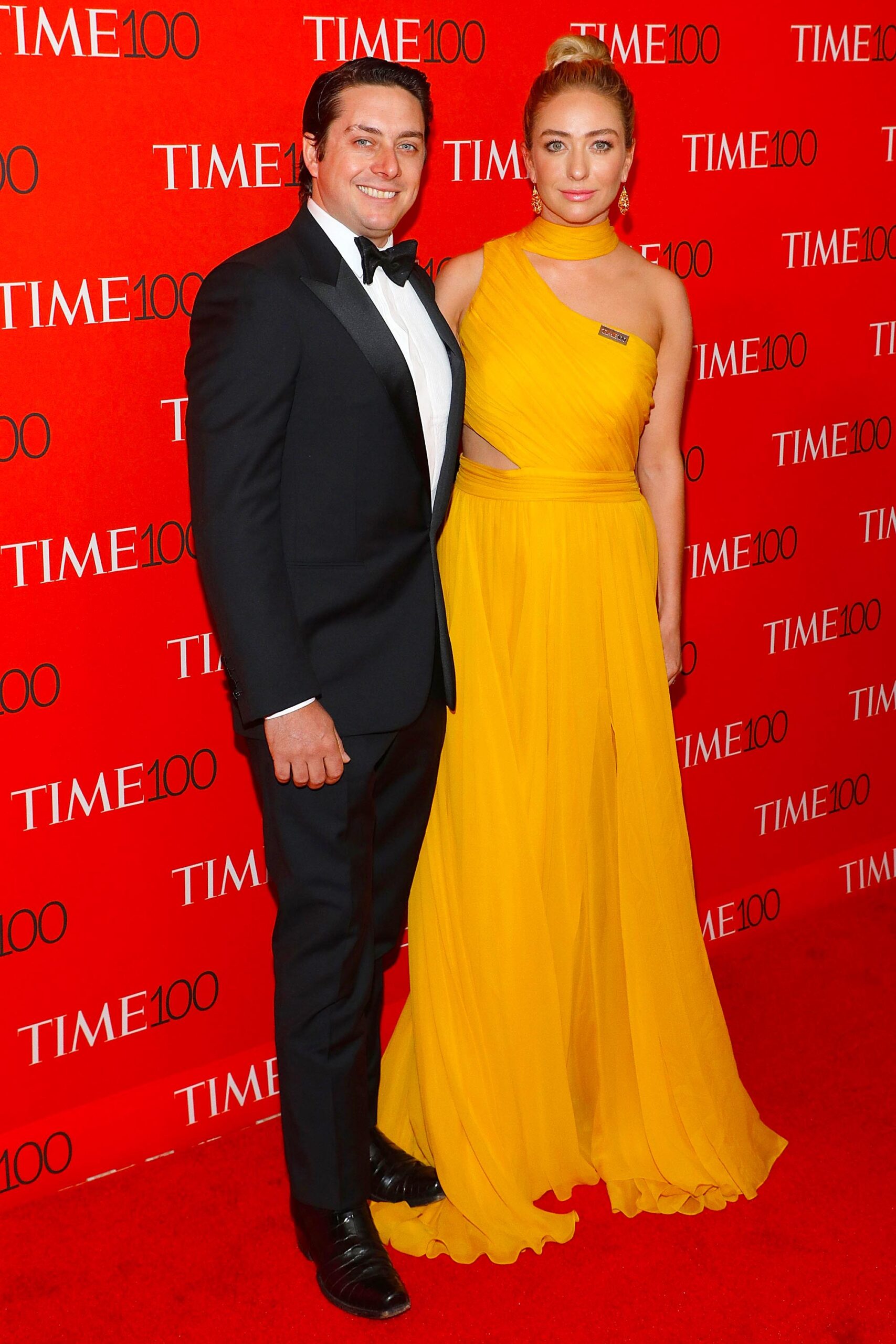 Whitney Wolfe Herd standing with her husband Michael on a Time 100 red carpet