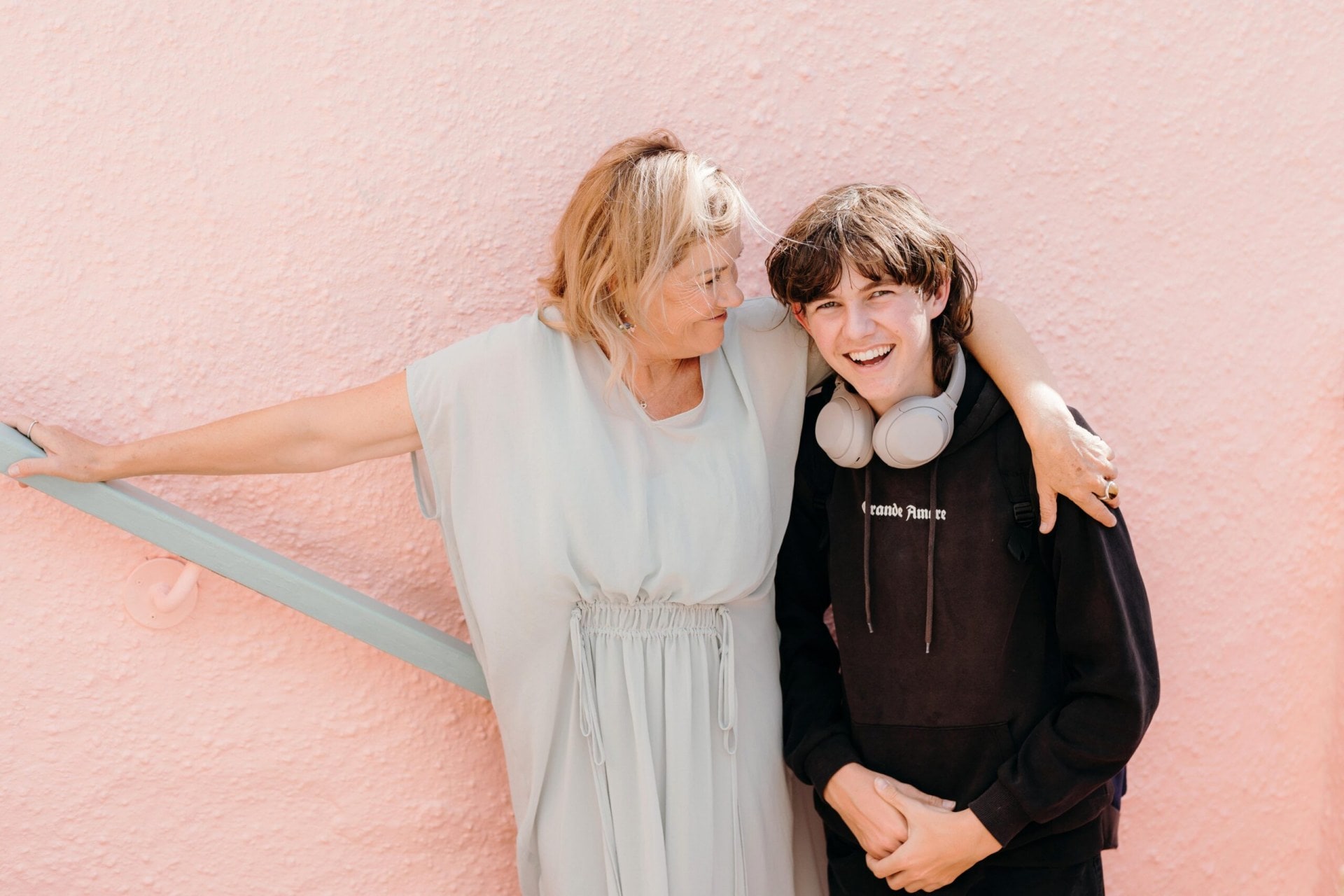 Robyn Malcolm with her arm around her son Pete laughing