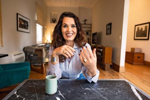 Erica Lloyd sitting in her living room