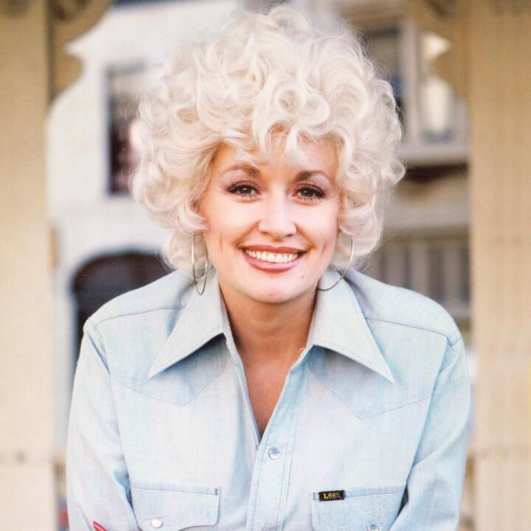 Dolly Parton in a blue shirt