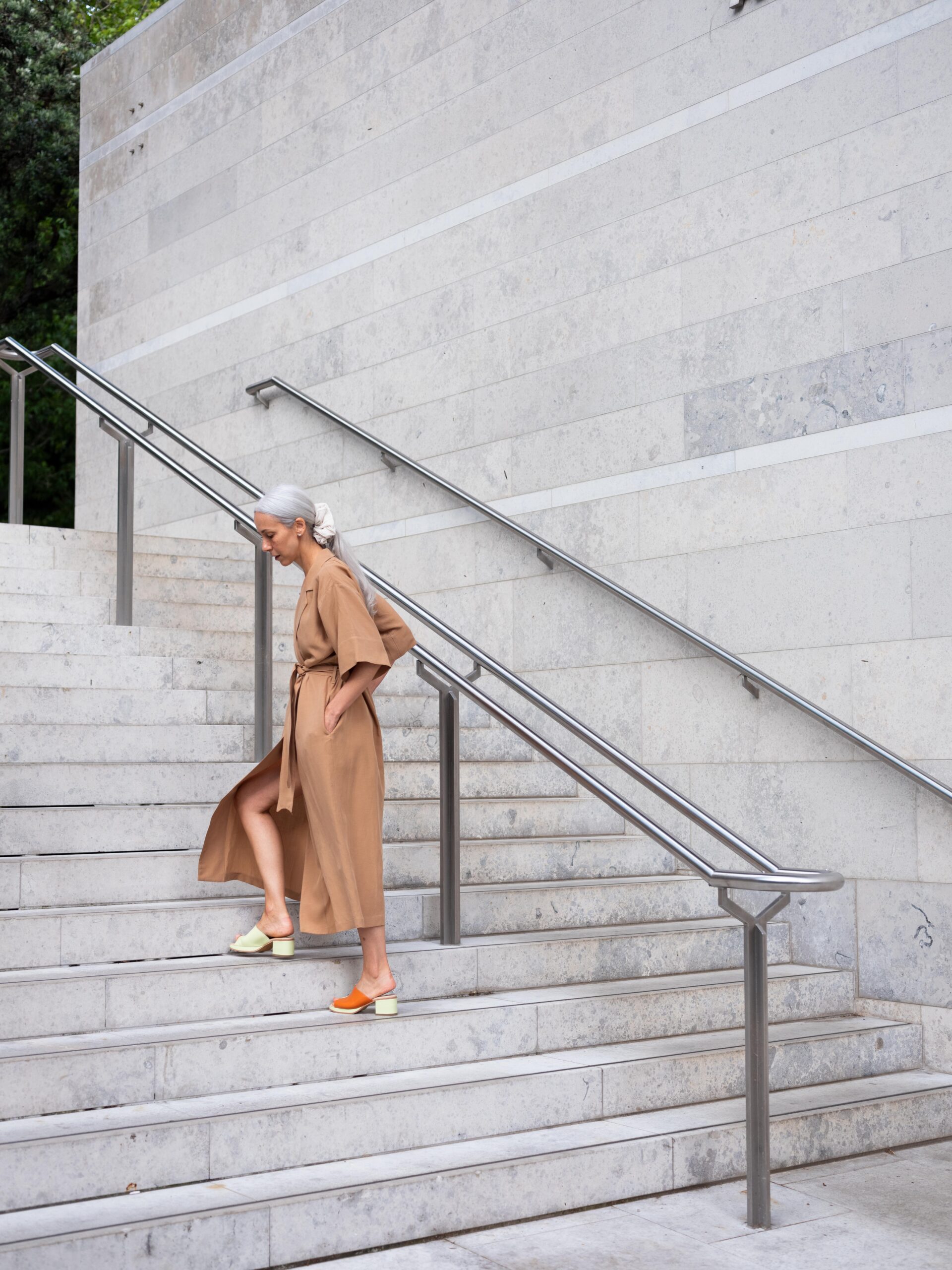 model wearing Ovna Ovich Ora shirt dress, $550, Post Sole Studio Summer Lane Contour heel, $490, Gloria silk scrunchie, $40