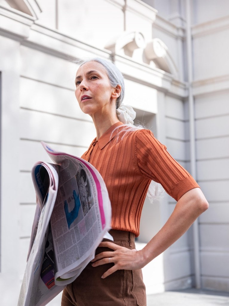 model wearing Kate Sylvester Portia shirt, $269, Penny Sage Noomi cords, $375, Gloria silk scrunchie, $40