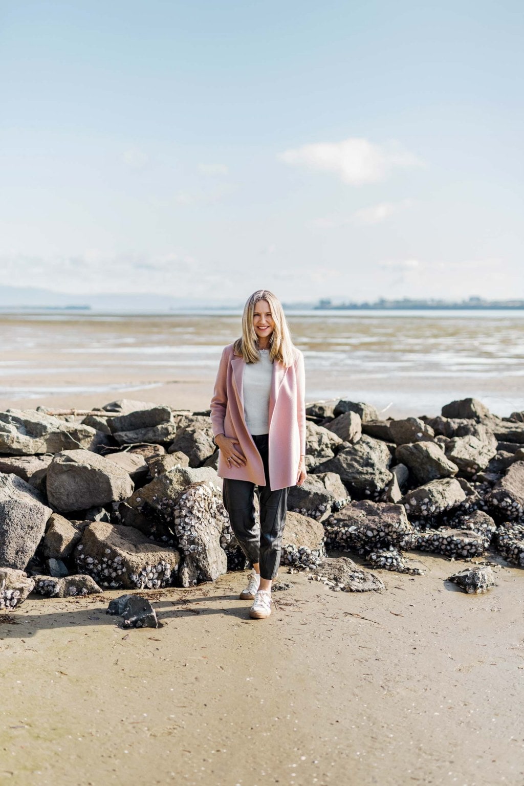 Sharon Hunter standing on a rocky beach
