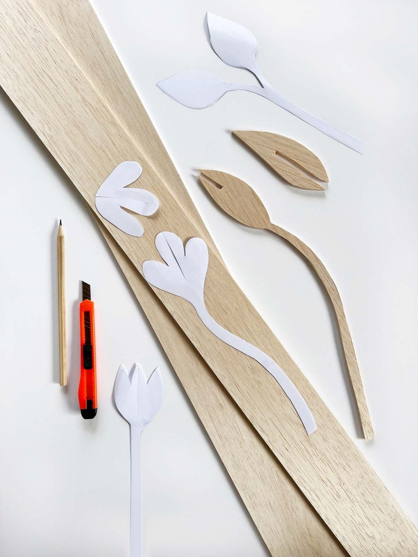 a flower stem template on top of pieces of wood