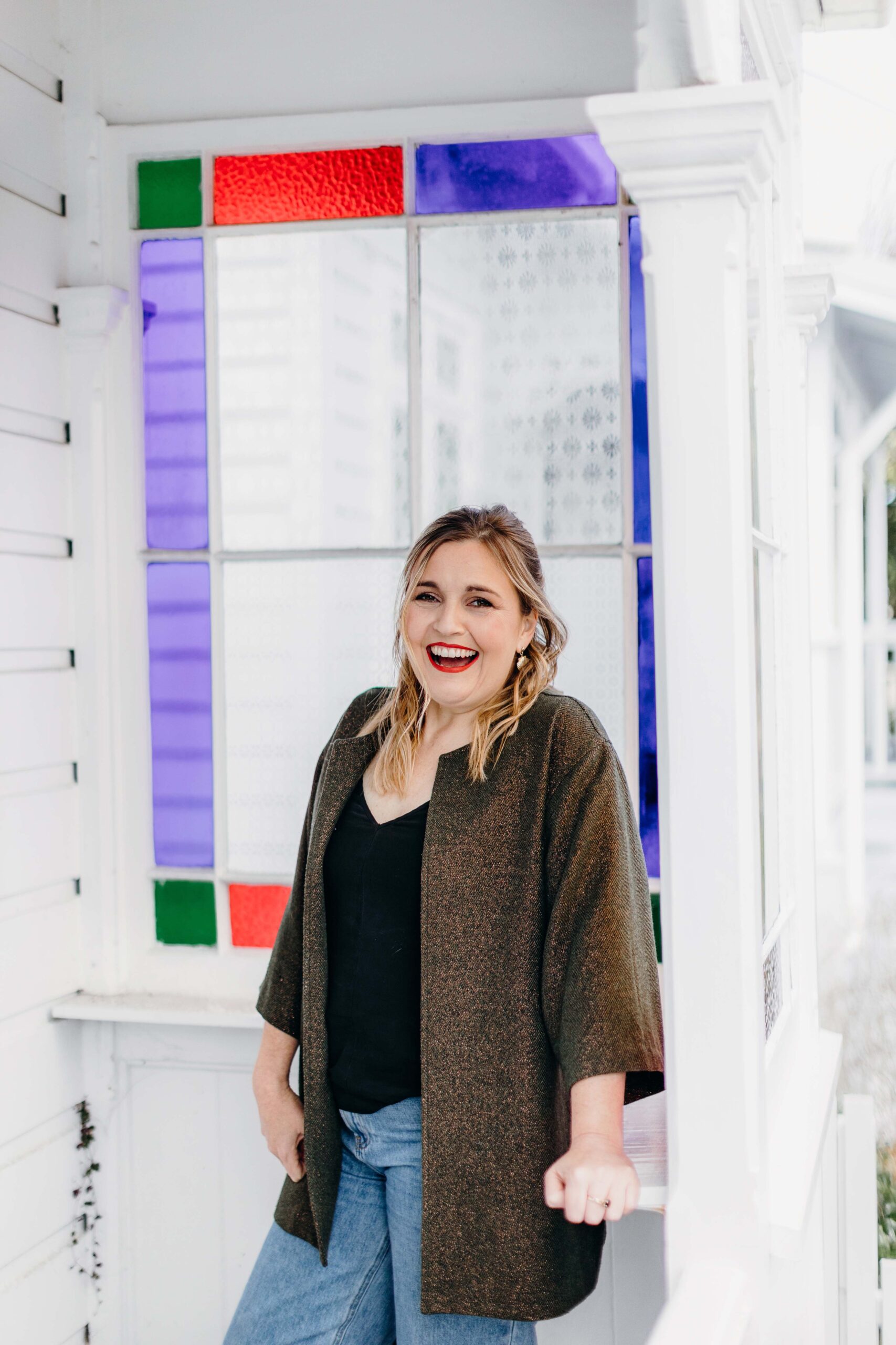 Charlotte Ryan standing in front of a stained glass window