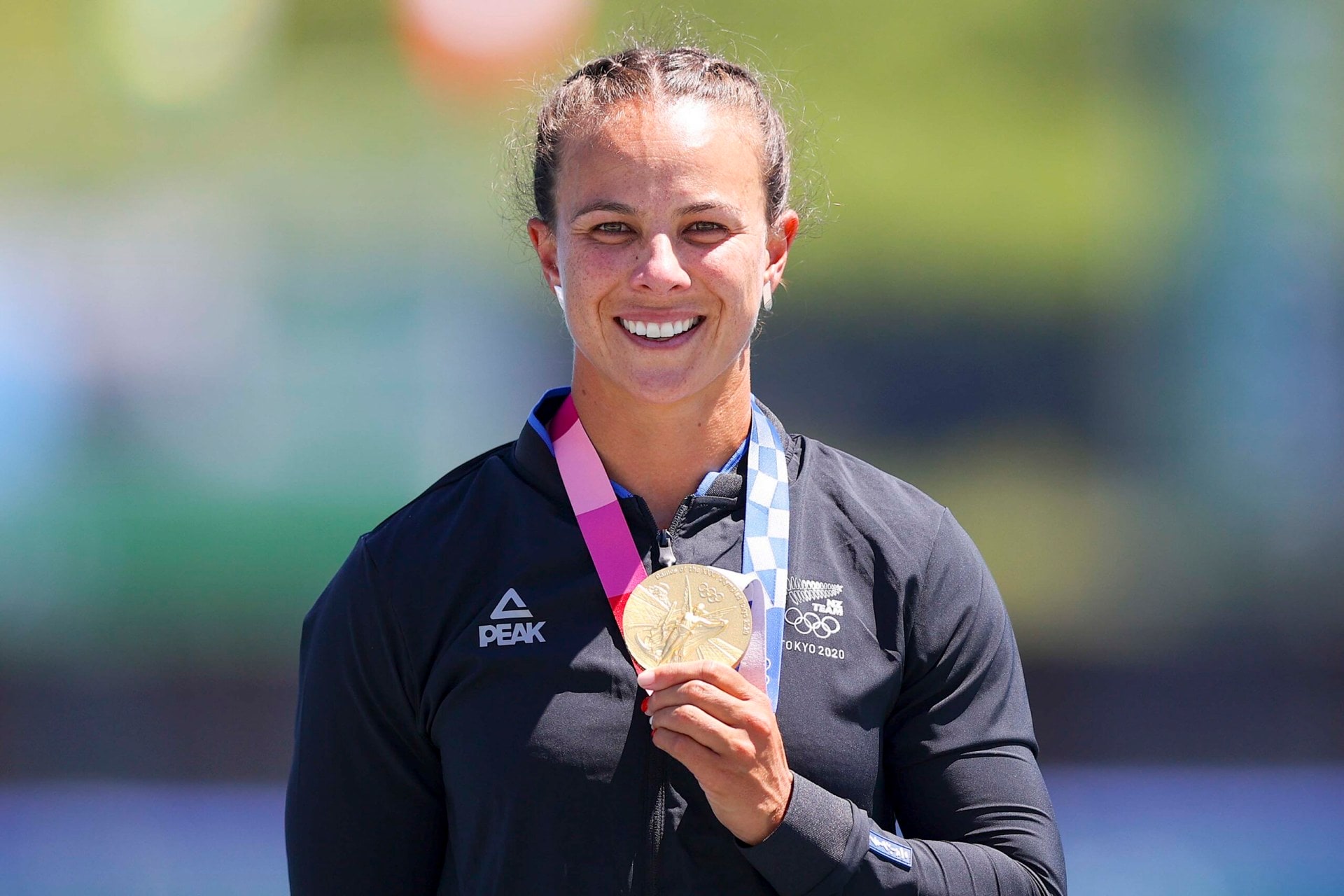 Lisa Carrington with one of her gold medals she won in Tokyo