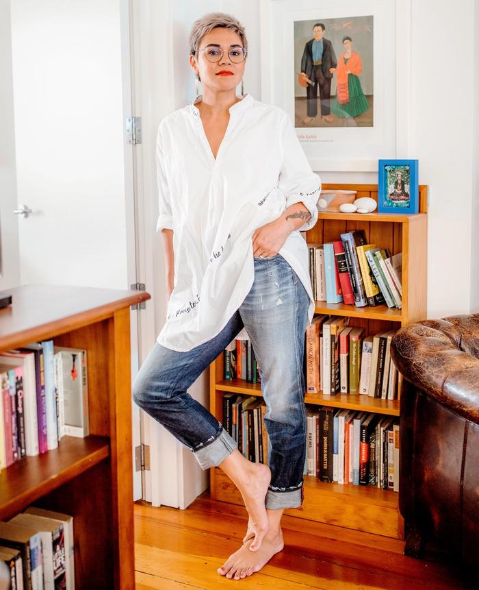 Emma Espiner wearing white blouse and blue jeans