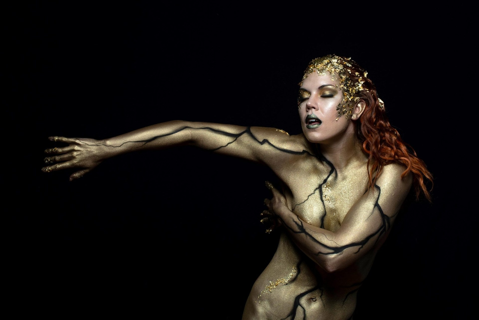 Hannah Tasker-Poland in gold and black body paint