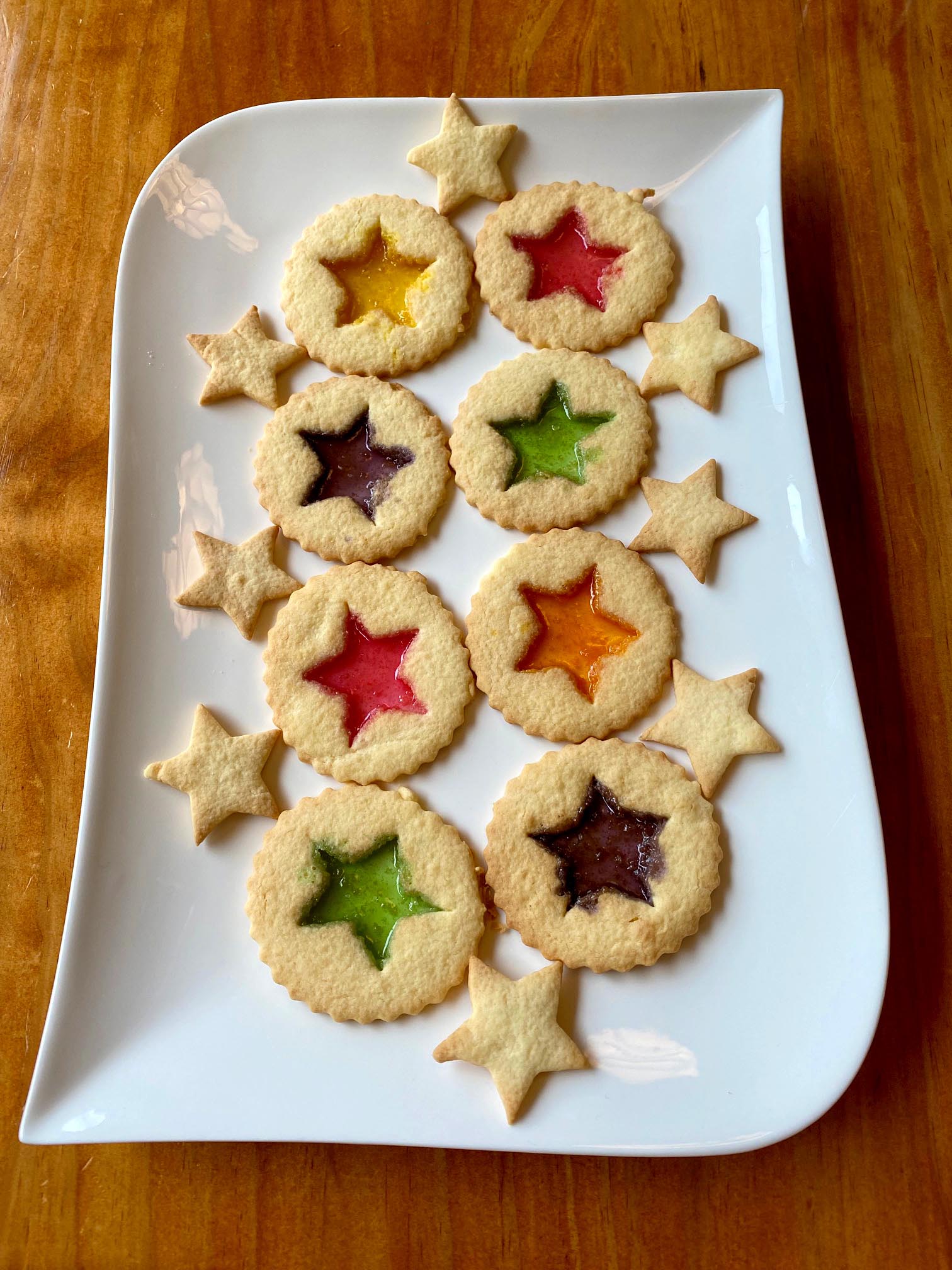 Round biscuits with colourful stained glass windows made out of lollies