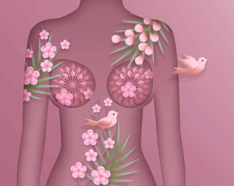 a pink illustration of a female body with flowers creating the detail