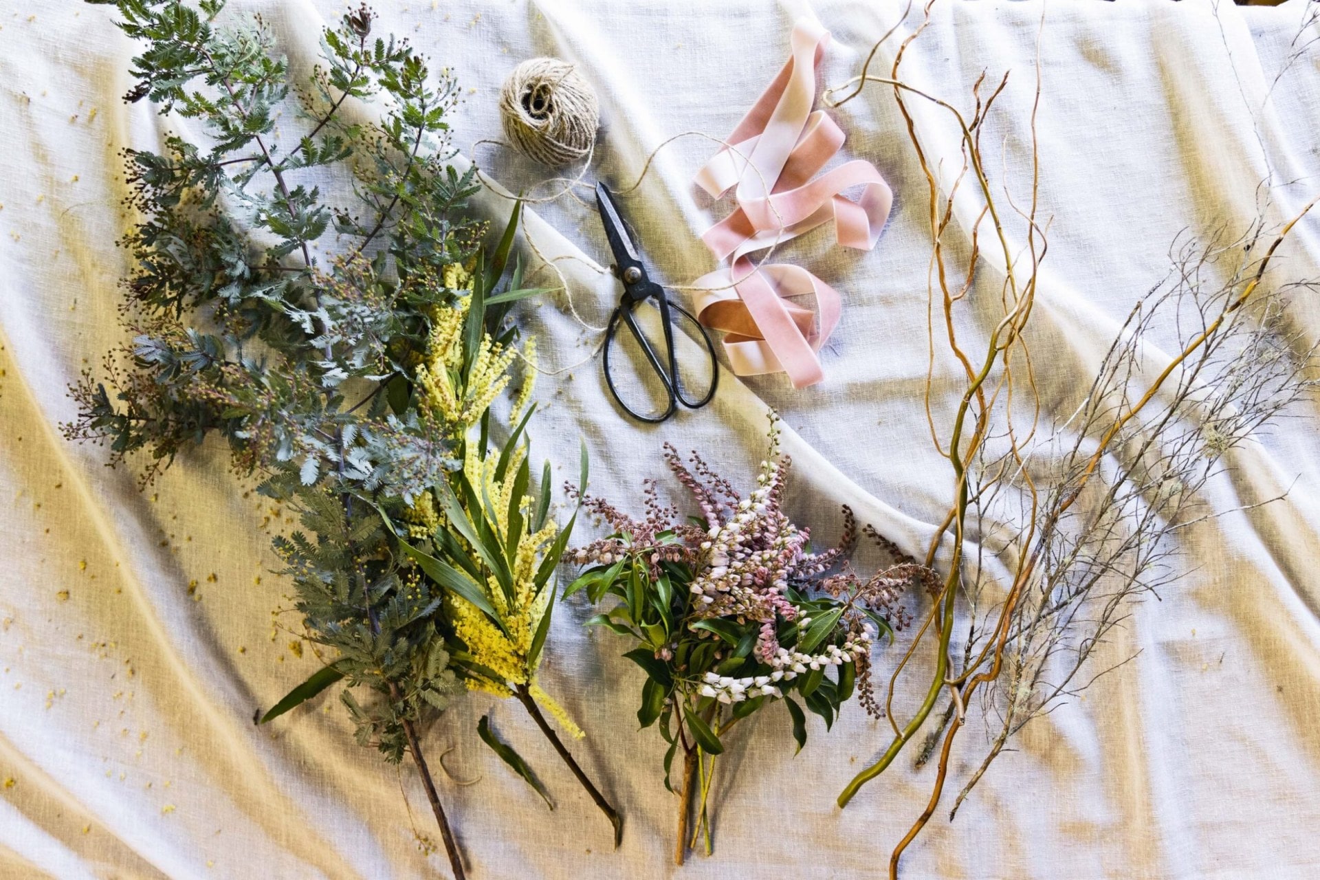 wreath making essentials including plant stems, flowers and ribbon