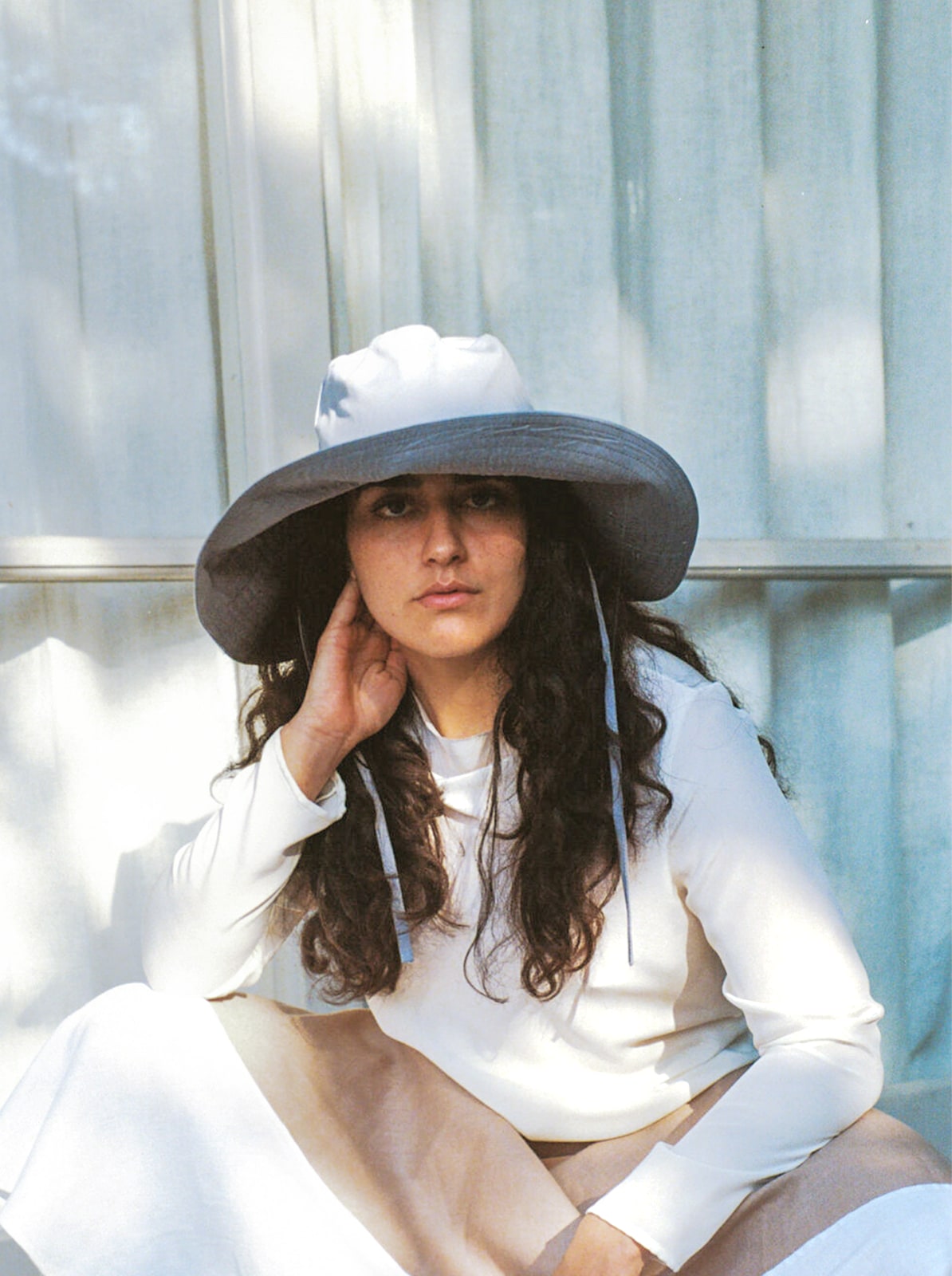 Model wearing blue Companion hat