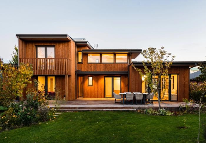 A wooden superhome in Riccarton with solar panels and large lawn