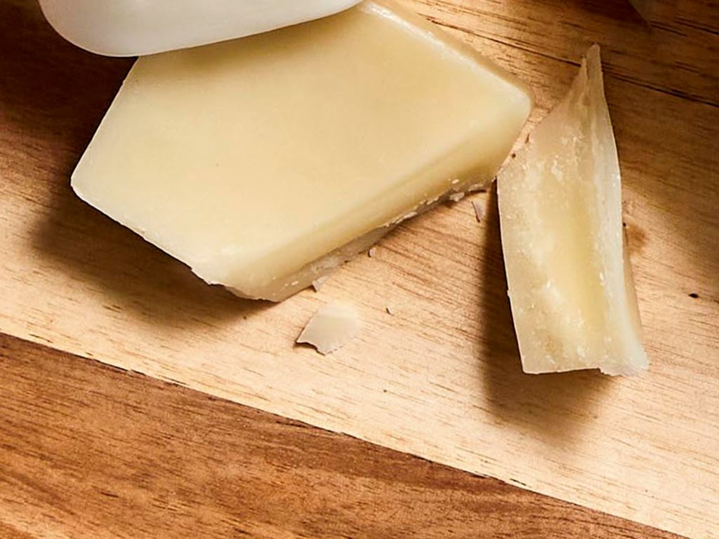 Frankie Vanilla and Kawakawa Conditioner Bar on a wood board