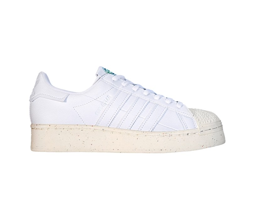 Beige and white Adidas Clean Classics Superstar shoe on a white background