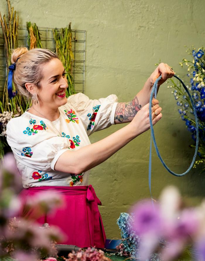 Dried flower wreath being glued 