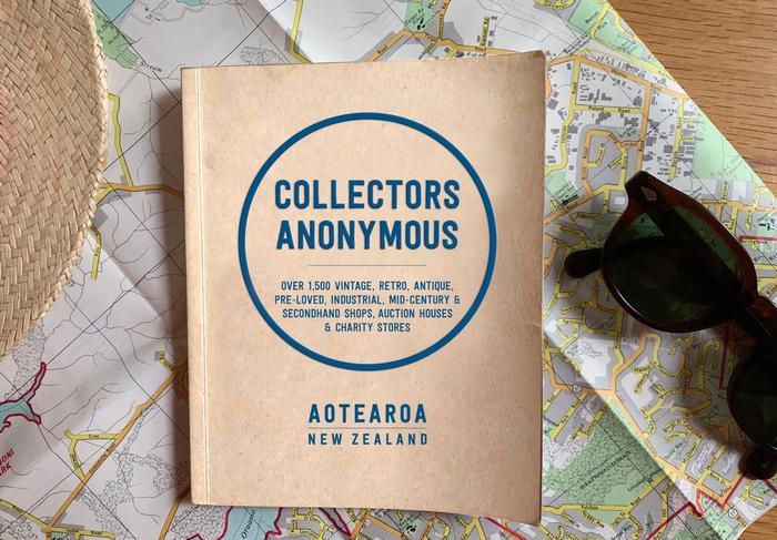 Collectors Anonymous book cover on map with accessories