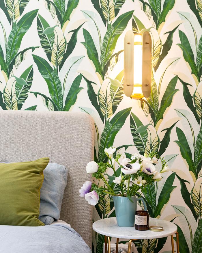 Botanical wallpaper with a bed
