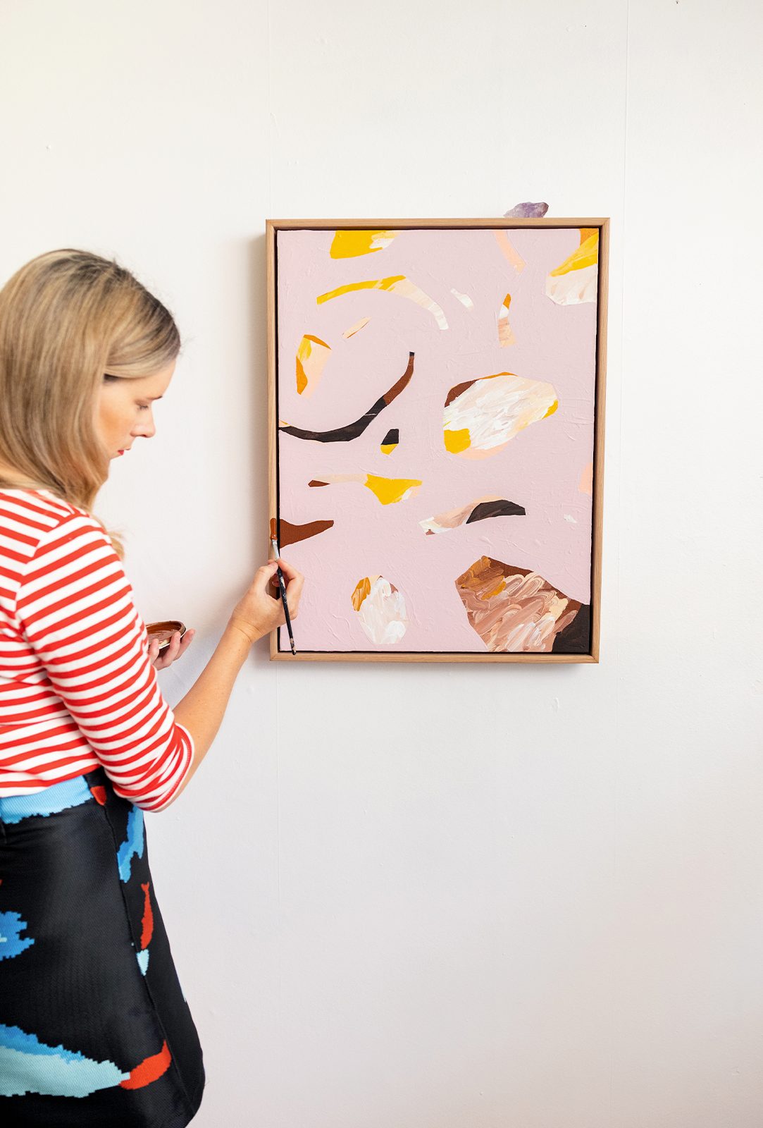 Alice Berry painting pink artwork hanging on wall 