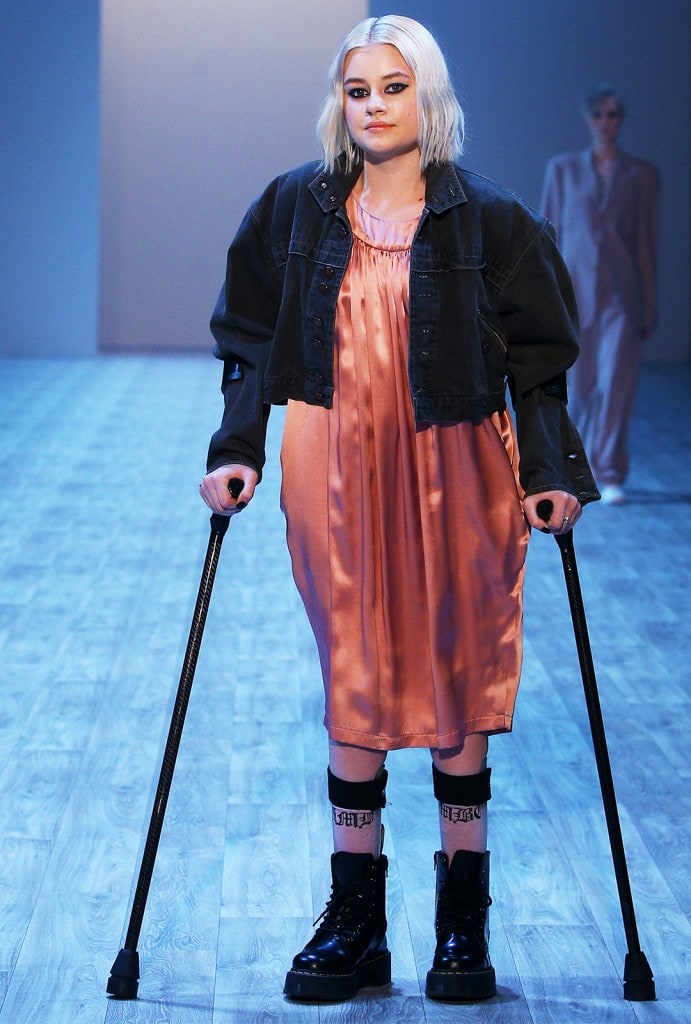 Model on crutches on catwalk at New Zealand Fashion Week