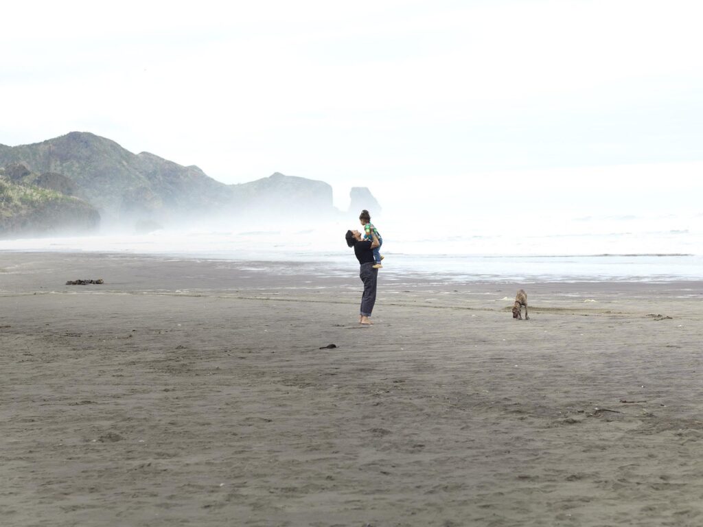 Anika Moa at Bethells Beach with daughter Marigold and dog Putiputi
