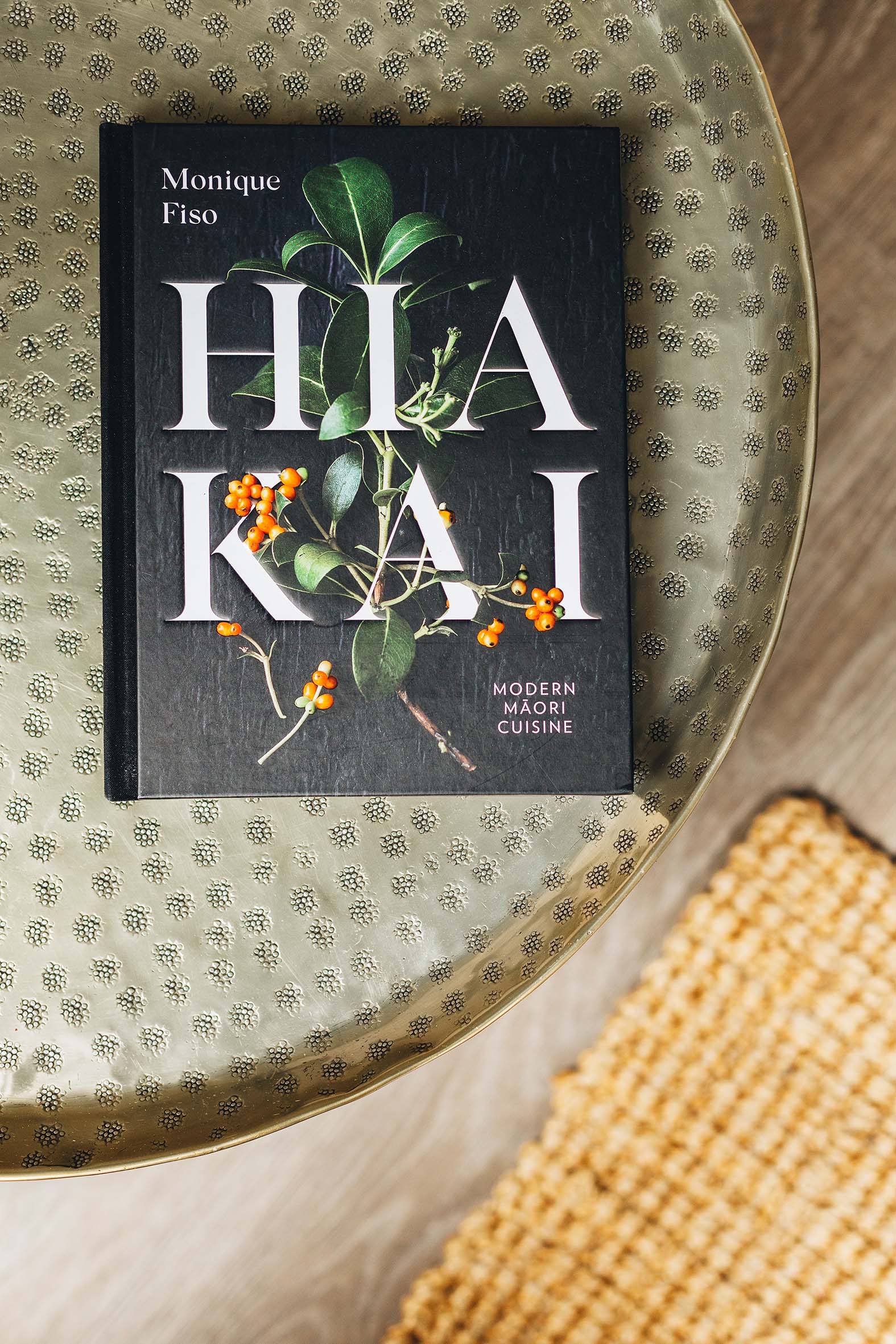 Hia Kai by Monique Fiso on a round dark green table 